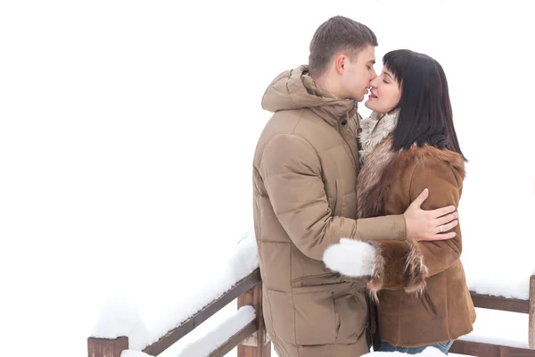 Young man kissing a beautiful woman — Stock Photo, Image