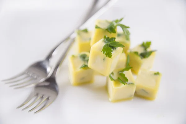 Oil cube frozen with parsley — Stock Photo, Image