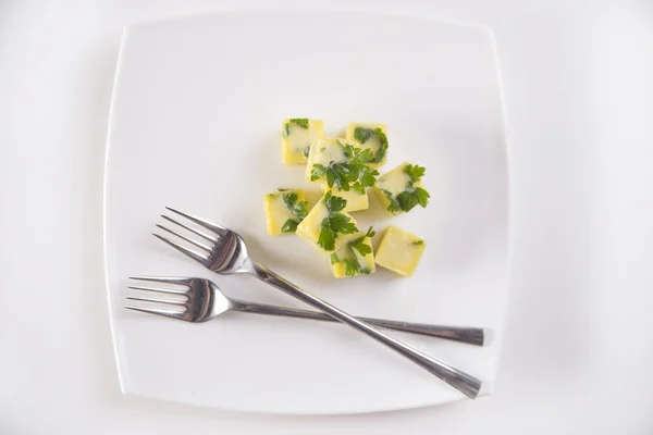 Oil cube frozen with parsley — Stock Photo, Image