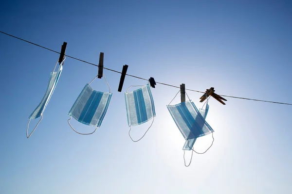 Backlit Photo Shoot Recovery Coronavirus Masks Washed Hung Out Dry — Foto de Stock