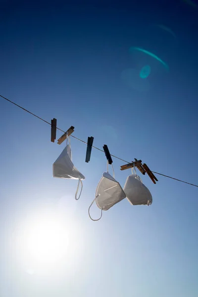 Backlit Photo Shoot Recovery Coronavirus Masks Washed Hung Out Dry — Stock Fotó