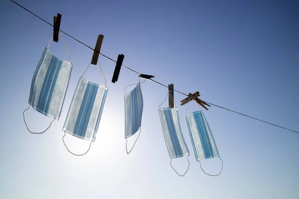 Backlit Photo Shoot Recovery Coronavirus Masks Washed Hung Out Dry — Stock Photo, Image