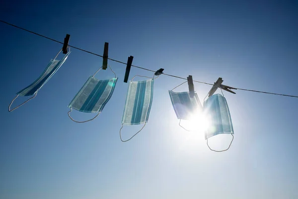 Backlit Photo Shoot Recovery Coronavirus Masks Washed Hung Out Dry — Foto de Stock