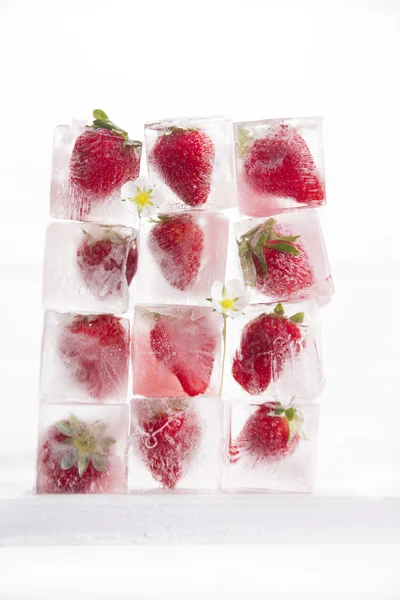 Ice cubes with strawberries — Stock Photo, Image