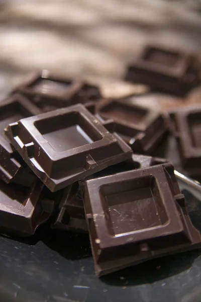 Cubes of dark chocolate — Stock Photo, Image