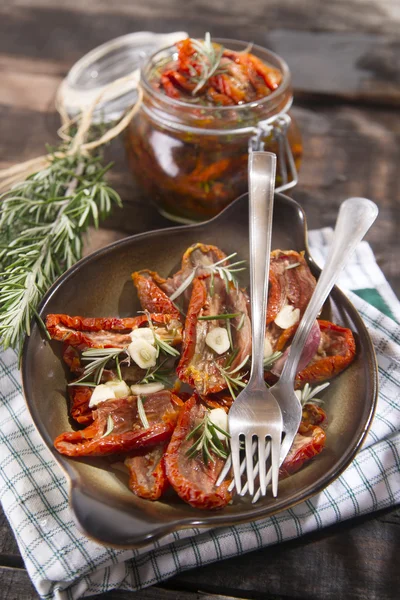 Dried tomatoes and rosemary — Stock Photo, Image