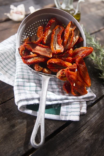 Dried tomatoes with rosemary — Stock Photo, Image