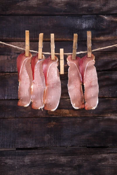 Smoked bacon hanging — Stock Photo, Image