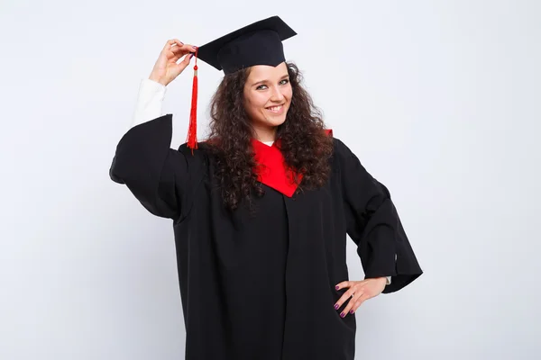 Vrouwelijke student in afstuderen jurk — Stockfoto