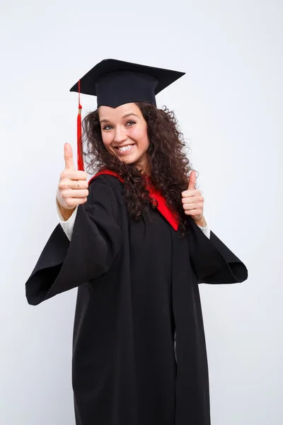 Vrouwelijke student in afstuderen jurk — Stockfoto