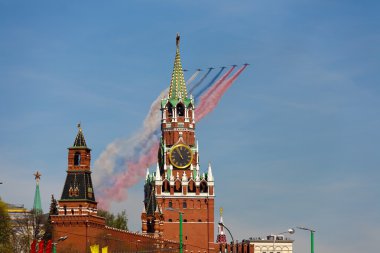 MOSCOW - MAY 9: Jets with colored smoke fly overhead during the