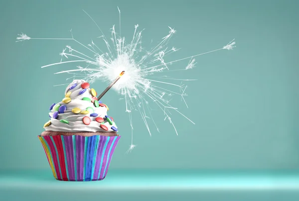 Delicious cupcake with a sparkler for an event celebration. — Stockfoto