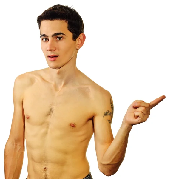 A man with naked body points aside — Stock Photo, Image