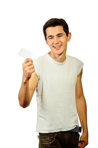 Um homem com um sorriso agradável tem um cartão de débito — Fotografia de Stock
