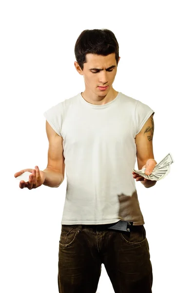 A man thinking - What is better: cash or debit card? — Stock Photo, Image