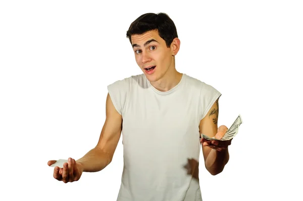 A confused guy - cash or debit (credit) card? — Stock Photo, Image