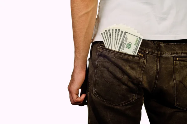 Man stands with the money in the back pocket — Stock Photo, Image