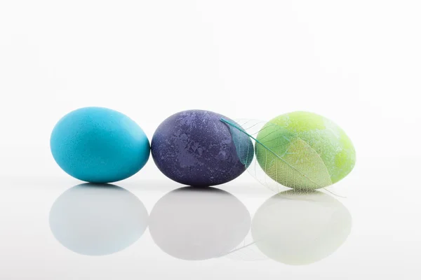 Three colored Easter eggs on white background — Stock Photo, Image