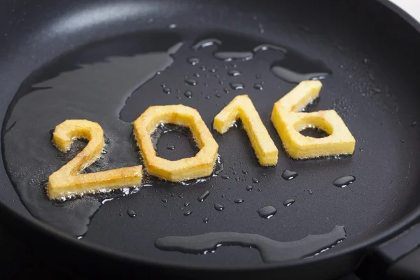 New year symbol fried on a pan — Stock Photo, Image