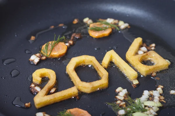 Numbers of the new year into pan — Stock Photo, Image