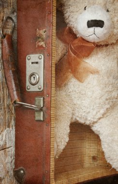 Vintage-style teddy bear and old suitcase clipart