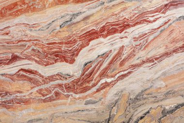 Kırmızı ve kremanın zengin damarları çarpıcı bir uyum içinde kıvrılarak doğanın sanatının büyüleyici bir gösterisini yaratıyor. Bu büyüleyici taş jeolojik zamanın ve yaratıcılığın güzelliğini gözler önüne seriyor..