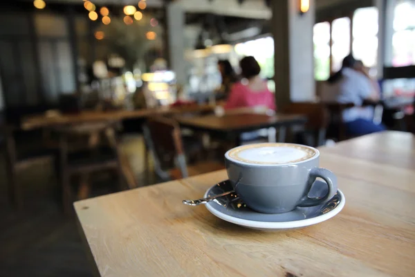 Café sobre fondo de madera —  Fotos de Stock