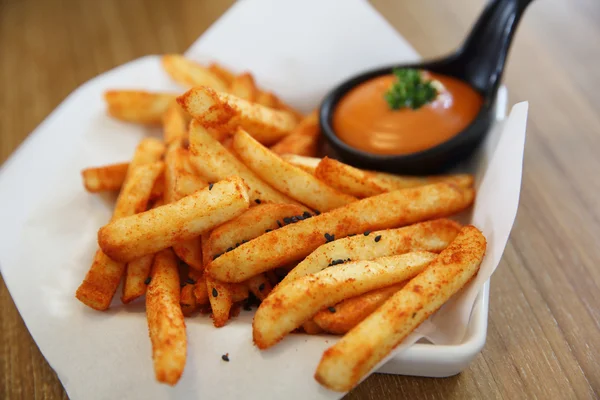 French fries with spicy sauce — Stock Photo, Image