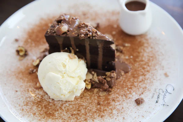 Dark chocolate cake with vanilla ice cream — Stock Photo, Image