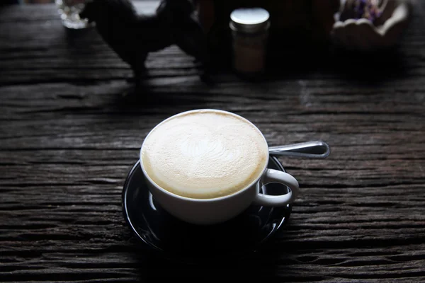 Cappuccino coffee on wood background — Stock Photo, Image