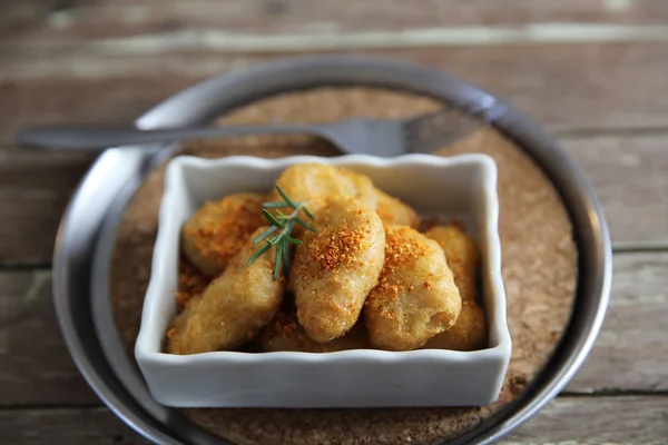 Nuggets on wood background — Stock Photo, Image