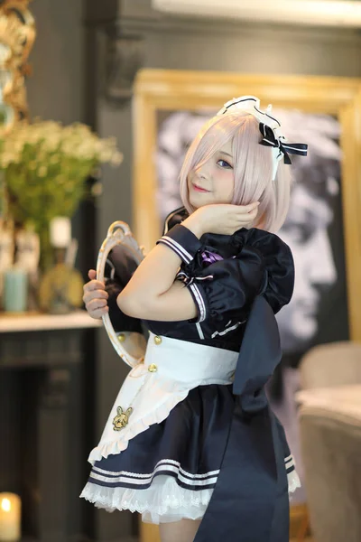 Japan anime cosplay portrait of girl with comic maid costume