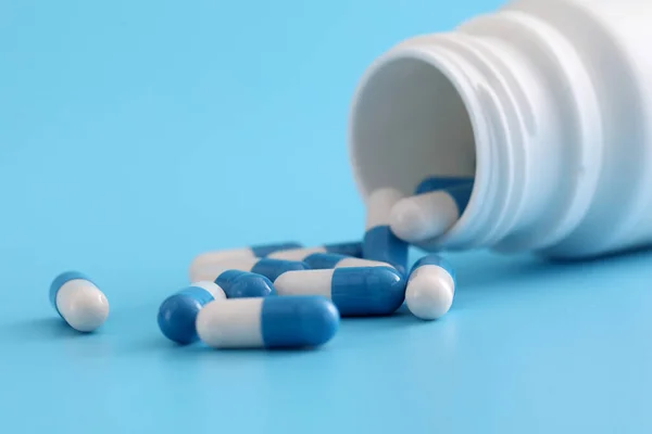 Pills Capsules Bottle Isolated Blue Background — Stock Photo, Image