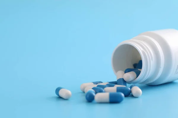 Pills Capsules Bottle Isolated Blue Background — Stock Photo, Image