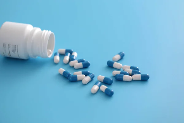 Pills Capsules Bottle Isolated Blue Background — Stock Photo, Image