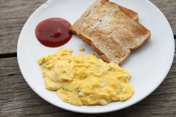 Omelette on wood background — Stock Photo, Image