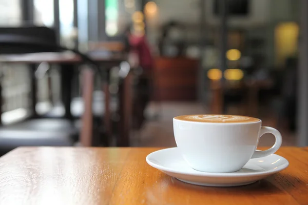Kaffe på trä bakgrund — Stockfoto