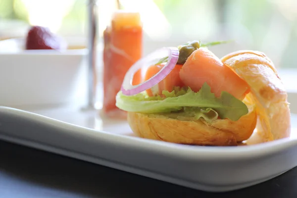 Canapes with smoked salmon — Stock Photo, Image