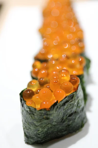 Salmon egg on sushi nigiri roll — Stock Photo, Image