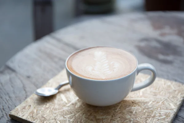 Kaffe på trä bakgrund — Stockfoto