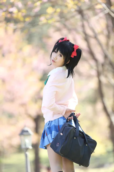 Asian schoolgirl with nature — Stock Photo, Image