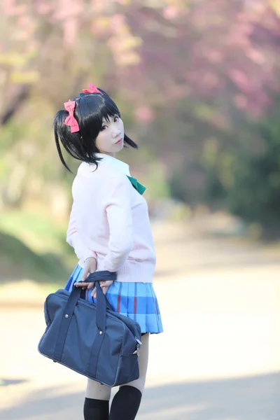 Asian schoolgirl with nature — Stock Photo, Image