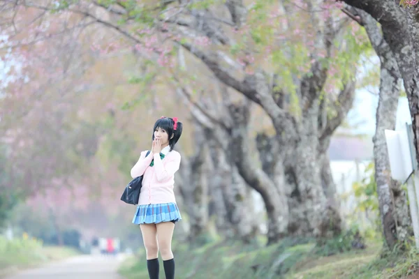 Asian schoolgirl with nature — Stock Photo, Image