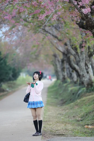 Asian schoolgirl with nature — Stock Photo, Image