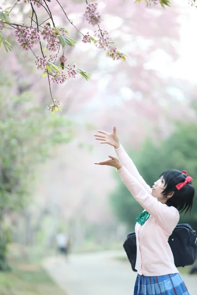 Asian schoolgirl with nature — Stock Photo, Image