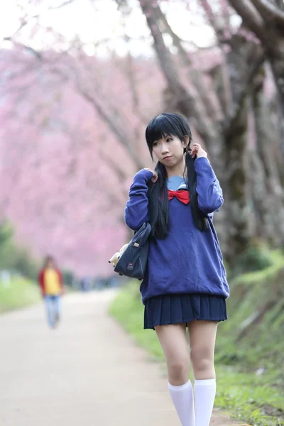 Asian schoolgirl with nature — Stock Photo, Image