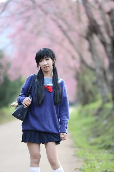 Asian schoolgirl with nature — Stock Photo, Image