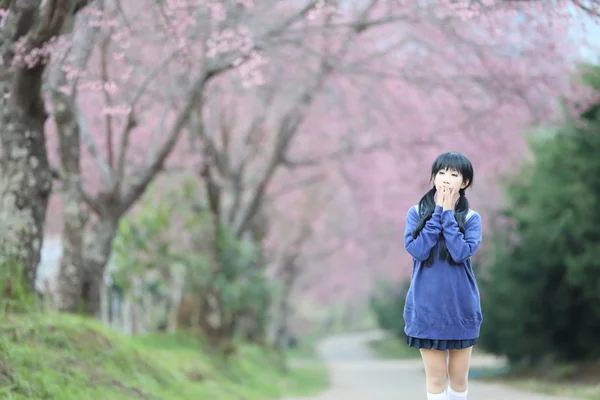 Asian schoolgirl with nature — Stock Photo, Image