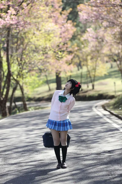 Asian schoolgirl with nature — Stock Photo, Image