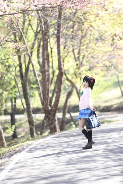 Asian schoolgirl with nature — Stock Photo, Image